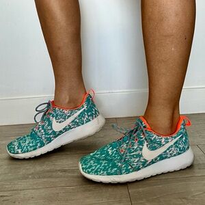 Nike Women's Teal Patterned Running Shoes with Coral Accents